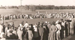 Black and white photo , golfers observing a golfer 