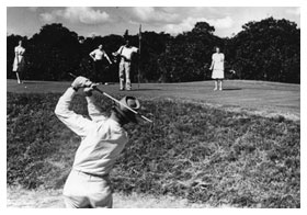 Black and white photo of golfer playing. 